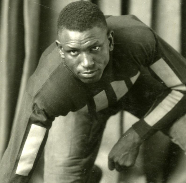 Holloway Smith in full body shot in a crouched position with one hand in front