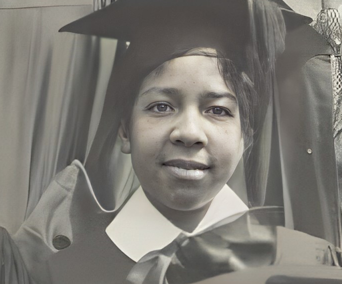 Headshot of Cora Mae Starland Trice Greene in high school graduation hat and robe 1919